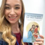 Debbie Cowden holding a copy of The Prayer Book for Tired Parents
