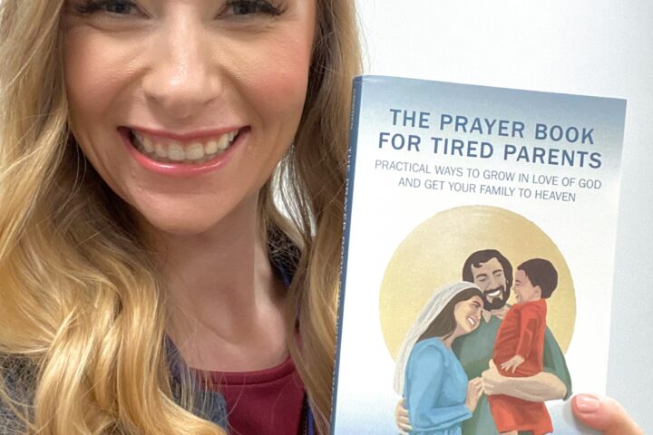 Debbie Cowden holding a copy of The Prayer Book for Tired Parents